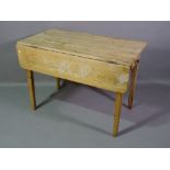 An early 20th century pine drop flap work table with single drawer on tapering square supports,