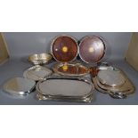 A quantity of 20th century silver plated trays and place mats, (qty).