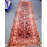 A Feraghan runner, Persian, the shaped black field with a herate pattern,