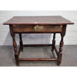 A 17th century oak single drawer side table, on baluster turned supports, 84cm wide x 71cm high.