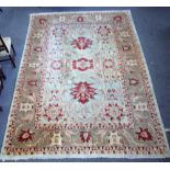 A Heriz carpet, Persian, the pale indigo field with bold madder palmettes and vine design,