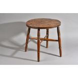A 19th century elm circular stool on turned beech supports, 46cm deep x 45cm high.