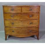 A George III mahogany bowfront chest of two short and three long graduated drawers,