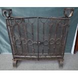 A 20th century blacksmith's made fire guard,