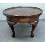 A Chinese Jichimu 'chicken-wing wood' circular occasional table on four scroll supports,