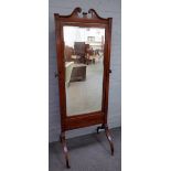 A late 19th century floral marquetry inlaid satinwood cheval mirror in the late George III style,