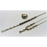 A silver and blue topaz necklace, detailed 925, a silver, gilt and diamond set ring,