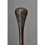 An Angolan Chokwe hardwood club, the bulbous head with incised geometric pattern decoration,