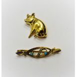 A 9ct gold and diamond set brooch, designed as a seated pig, having a diamond set eye and a gold,