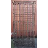 A four hundred bottle wrought iron wine rack, with hinged front doors,