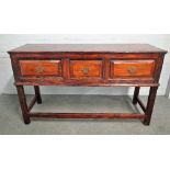 A 18th century stained pine dresser base, with three frieze drawers on block supports,