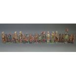 A group of Indian early 20th century painted wool and gesso figures, each with moveable arms,