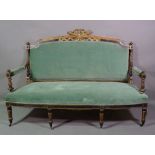 A Regency polychrome painted sofa with ribbon tied crest on fluted tapering supports, 165cm wide.