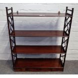 A George III mahogany three tier hanging shelf, with Cockpen sides,
