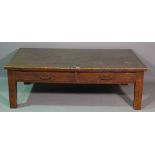 A 20th century oak two drawer coffee table, on block supports, 136cm wide x 44cm high.