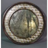 A 20th century circular mirror with painted parquetry decoration, 85cm wide.