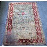 An antique rug, possibly a Kashan Souf,