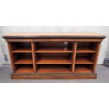 A Victorian style figured walnut floor standing three section bookcase with barleytwist mounts,