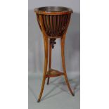 An Edwardian marquetry inlaid mahogany jardiniere stand, with three splay supports,