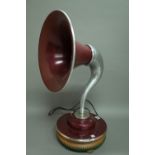 A J.S Stevens 1950s gramophone (converted) table lamp, raised on a later wooden plinth, 66cm high.