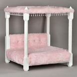 A 21st century faux pink fur and Swarovski mounted four poster cat bed, 62cm wide x 68cm high.