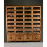 JAMES BOOTLE LTD, COMPLETE SHOP FITTERS, EASTBOURNE; a mid-20th century oak haberdashery cabinet,
