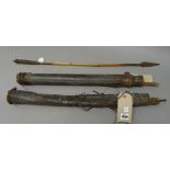A quantity of African bamboo arrows with steel tips, held in two leather quivers (Qtty.).
