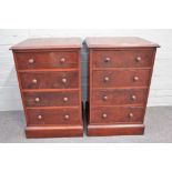 A pair of hardwood bedside tables, of four long graduated drawers on plinth base,