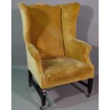 A George III style mahogany framed wing armchair.