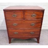 A small George III mahogany chest of two short and two long graduated drawers, on splayed supports,