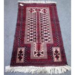 A Beluchistan prayer rug, the beige mihrab filled with a tree of life,