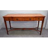 A George III style yew breakfront three drawer serving table, on tapering square supports,