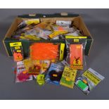 Fishing interest, including; fly tying tools and materials and fly hooks, mainly unused in packets,