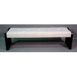 A 20th century hardwood framed rectangular footstool with white button upholstery,