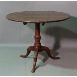 A George III oak circular tilt top tripod table, on outswept supports, 87cm wide x 70cm high.