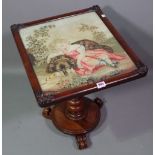 A Victorian mahogany occasional table with tapestry inset panel on plinth base,