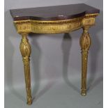 A Regency style gilt wood bowfront console table with later added mahogany top on taping supports,