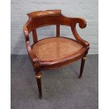 A 19th century French gilt metal mounted walnut tub back office chair on tapering fluted supports,