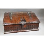 A 17th century oak slope front bible box with carved front panel, 64cm wide x 30cm high.