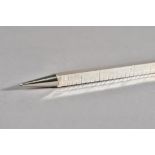 A silver 12 inch / 30 centimetre ruler of square section form with a propelling pencil to one end,