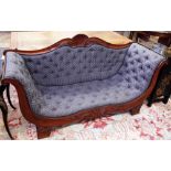 A 19th century continental walnut framed sofa with roll over ends on gadrooned block feet,
