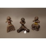 Three African fertility dolls, possibly Namji, each carved wood with beaded decoration, 20cm high,