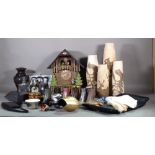 Decorative objects, including; carved wooden vases, resin shoe models,
