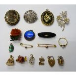 A 9ct gold seal fob charm, five gold mounted mostly charms, seven brooches and pins,