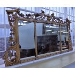 A 19th century Chinese Chippendale style triple panel mirror with ho-ho bird and face mask