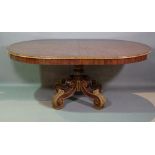 A 20th century Italian mahogany oval dining table on four gilt acanthus moulded outswept supports,