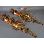 A pair of Regency style painted two branch wall lights with acanthus and fruit decoration, (2).