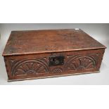 An 18th century oak bible box, with carved front panel, 60cm wide x 20cm high.