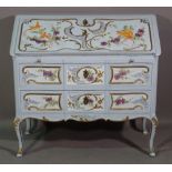 A 20th century French style blue painted bureau with two long drawers decorated with birds and