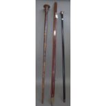A hardwood and brass mounted yard measure (102cm), a silver mounted ebonised walking cane,
